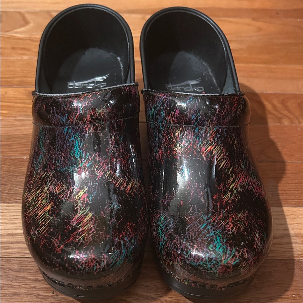 Woman’s 36 Black multicolored Dansko Clogs